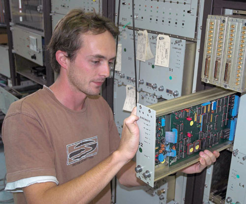 Scott working on electronic components in the back-up test antenna rack.