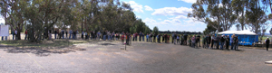 A long queue of people stretches across this panoramic image