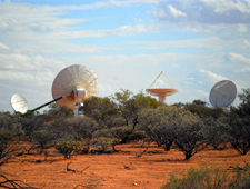 Four of CSIRO's new ASKAP antennas are pictured at the Murchison Radio-astronomy Observatory in Western Australia, October 2010. Credit: Ross Forsyth, CSIRO.