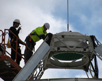 CSIRO's ASKAP team installing the PAF on the 12-metre antenna at the Parkes Testbed Facility. Credit: Aidan Hotan, CSIRO.