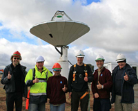 The CSIRO ASKAP team celebrating the installation of the PAF on the 12-metre antenna at the Parkes Testbed Facility. Credit: John Sarkission, CSIRO.