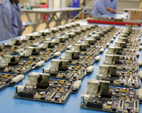 Electronics boards laid out on a factory bench. Credit: CSIRO.