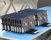 Electronics boards laid out on a factory bench. Credit: CSIRO.