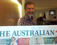 ASKAP Project Director Antony Schinckel with the front page of the Australian newspaper. Credit: CSIRO.