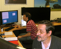 CSIRO astronomers Drs Tasso Tzioumis (foreground) and Chris Phillips during the observing run. Credit: Helen Sim, CSIRO.
