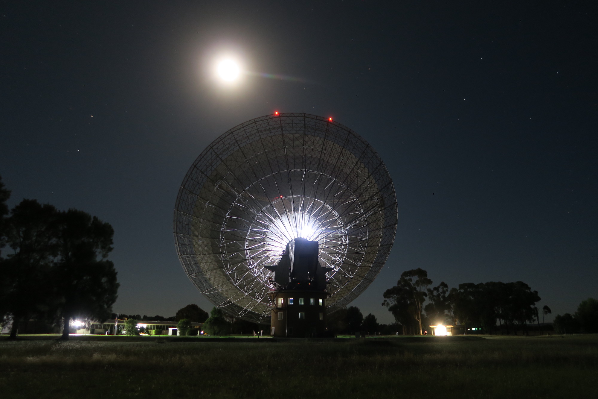 Murriyang, the Parkes 64m radio-telescope, pictured at night tracking the Odysseus lunar lander.