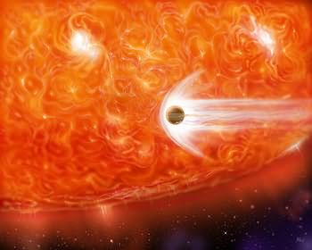 An artist's impression of a red supergiant engulfing a Jupiter-like planet as it expands.