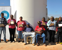 The Wajarri Yamatji family representatives hold the plaques that will be affixed to CSIRO's ASKAP antennas. Credit: Dragonfly Media.