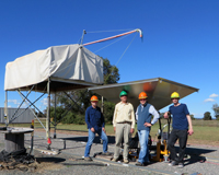 Team members stand with the NRC Vivaldi PAF during tests.